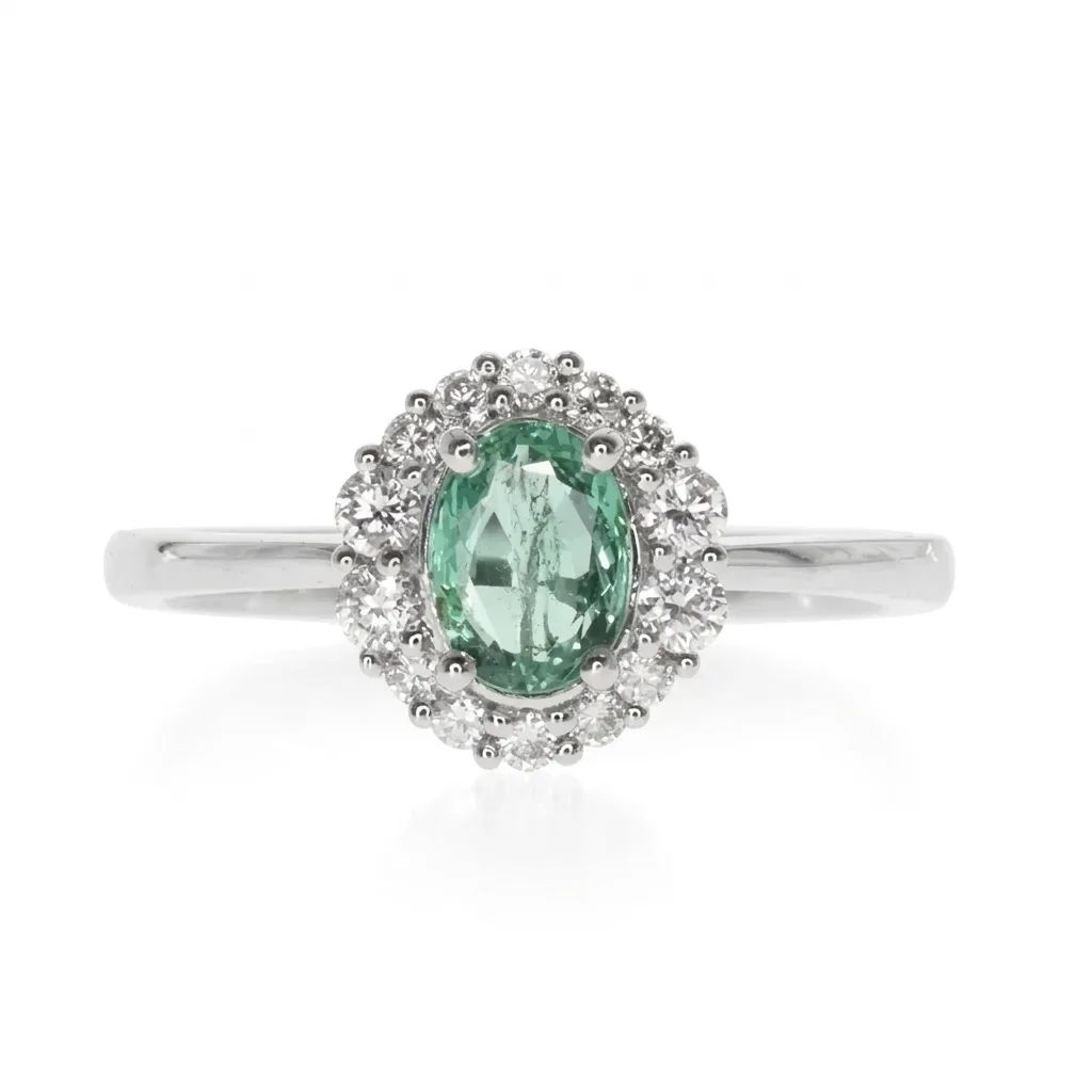 Oval Halo Emerald & Diamond Engagement Ring in 950 Platinum